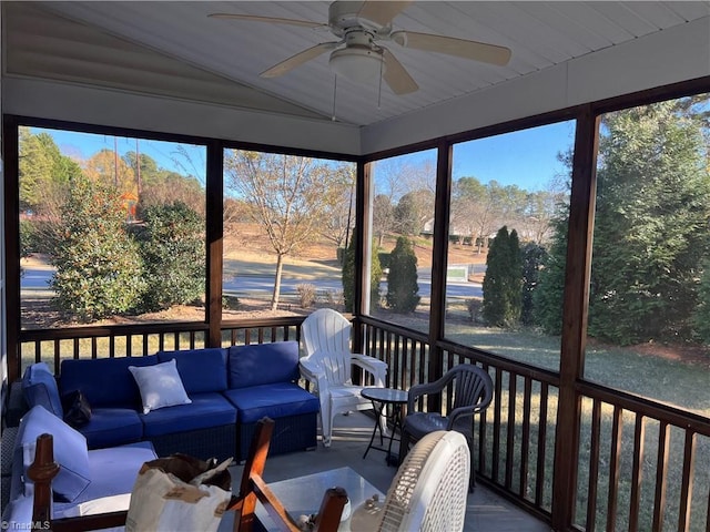 sunroom / solarium featuring ceiling fan