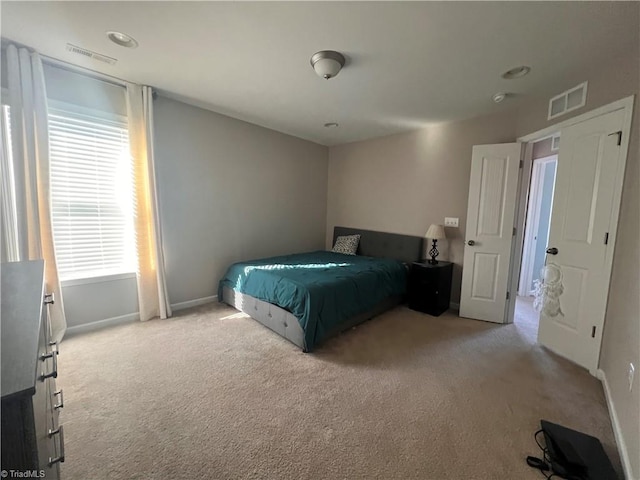 unfurnished bedroom with light colored carpet