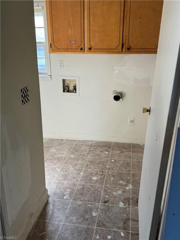 laundry area with cabinets, hookup for a washing machine, and electric dryer hookup