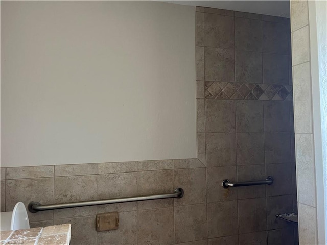 full bathroom with a tile shower