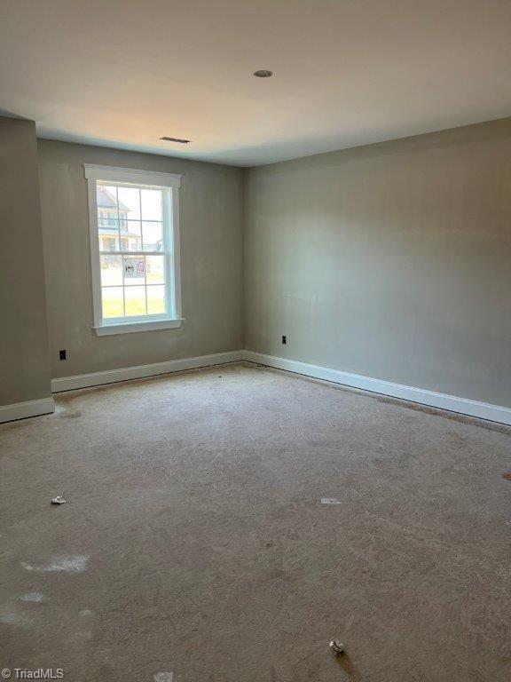 view of carpeted spare room