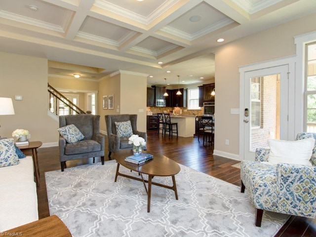 living room featuring crown molding, a healthy amount of sunlight, and dark hardwood / wood-style floors