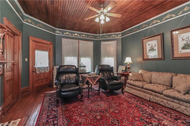 living room with crown molding, dark hardwood / wood-style flooring, ceiling fan, and wooden ceiling