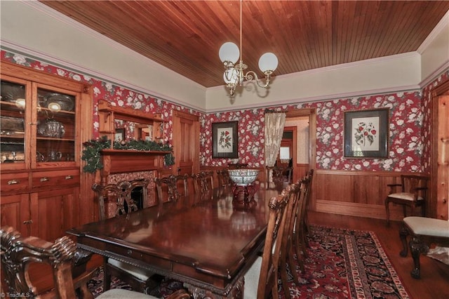 dining room with wooden ceiling, hardwood / wood-style flooring, crown molding, and an inviting chandelier