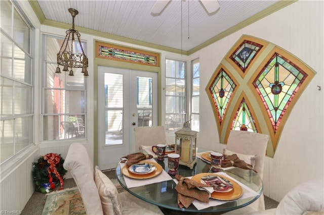 dining area with french doors, a healthy amount of sunlight, and crown molding