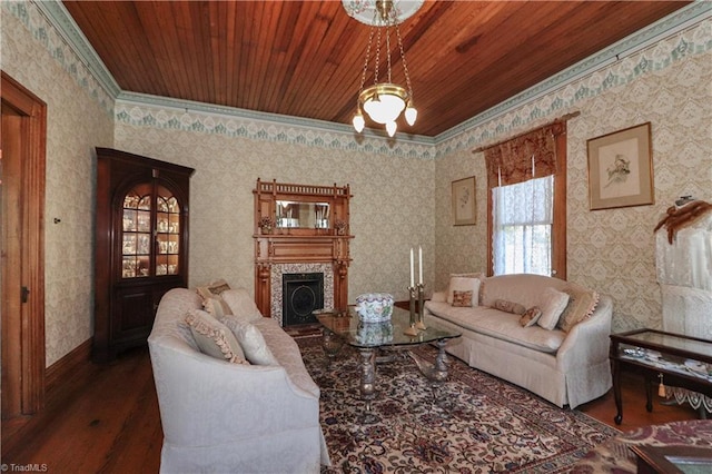 living room featuring crown molding, dark hardwood / wood-style floors, and wooden ceiling