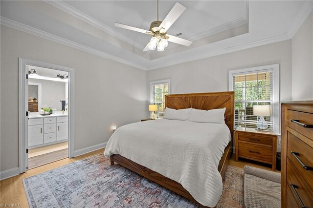 4944 Little Store Rd, Mcleansville, NC 27301 - bedroom with a raised ceiling, crown molding, light wood-type flooring, baseboards, and ensuite bath