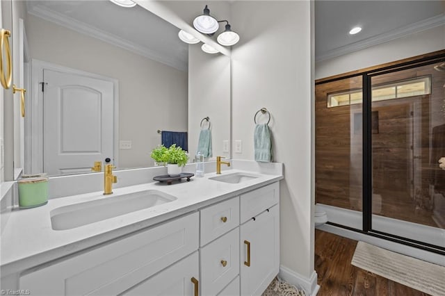 4944 Little Store Rd, Mcleansville, NC 27301 - bathroom with crown molding, double vanity, toilet, an enclosed shower, and wood finished floors