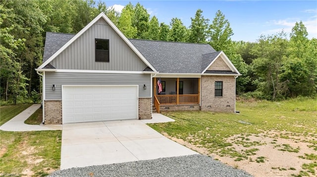 4944 Little Store Rd, Mcleansville, NC 27301 - craftsman-style home with a porch, brick siding, concrete driveway, and a front yard