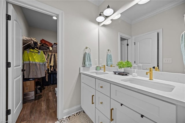4944 Little Store Rd, Mcleansville, NC 27301 - full bathroom featuring ornamental molding, double vanity, wood finished floors, a walk in closet, and baseboards