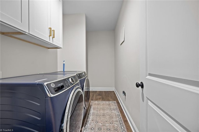 4944 Little Store Rd, Mcleansville, NC 27301 - laundry area featuring dark wood-style floors, washing machine and dryer, cabinet space, and baseboards