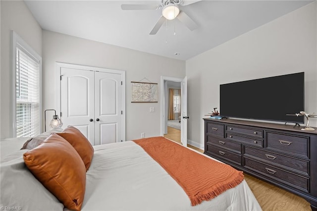 4944 Little Store Rd, Mcleansville, NC 27301 - bedroom with a closet, wood finished floors, a ceiling fan, and baseboards