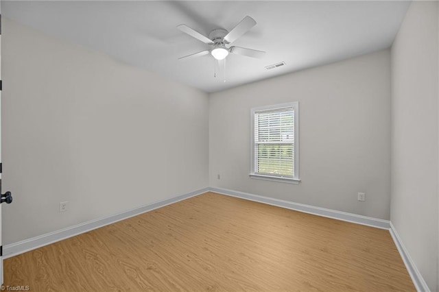 4944 Little Store Rd, Mcleansville, NC 27301 - unfurnished room featuring wood finished floors, baseboards, and a ceiling fan