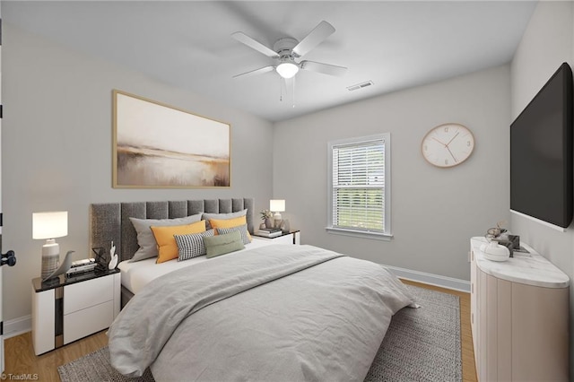 4944 Little Store Rd, Mcleansville, NC 27301 - bedroom featuring light wood-style floors, baseboards, and a ceiling fan