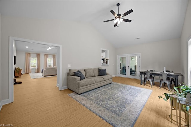 4944 Little Store Rd, Mcleansville, NC 27301 - living area featuring a ceiling fan, french doors, wood finished floors, high vaulted ceiling, and baseboards