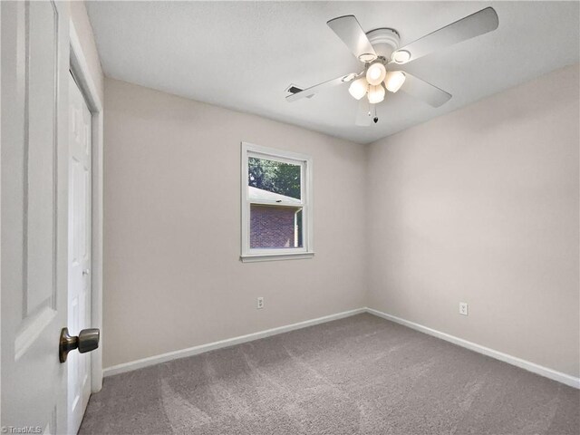 unfurnished bedroom featuring a closet, carpet flooring, a ceiling fan, and baseboards