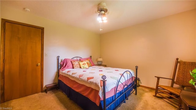 bedroom with carpet flooring and baseboards