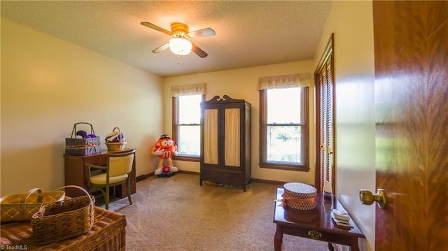 playroom featuring ceiling fan, carpet floors, a textured ceiling, and baseboards