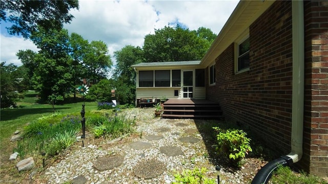 view of yard with a sunroom