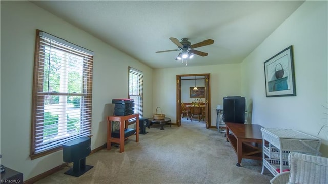 office area with ceiling fan, carpet, and baseboards