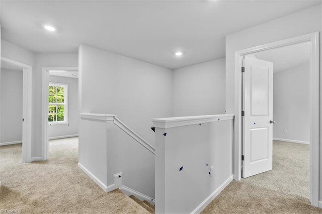 4192 Emmas Way E, Bend, NC 27018 - corridor with an upstairs landing, carpet floors, baseboards, and recessed lighting