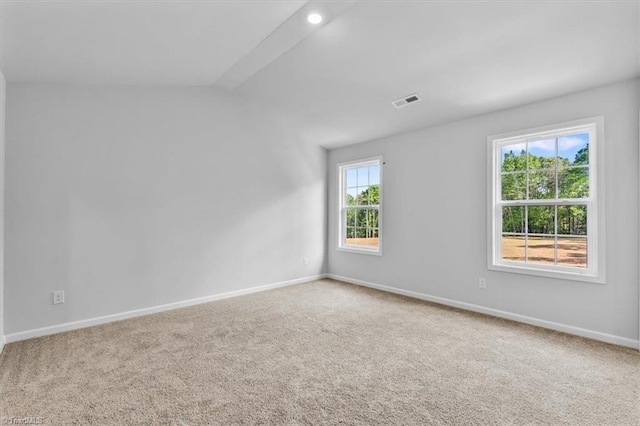 4192 Emmas Way E, Bend, NC 27018 - spare room featuring carpet, baseboards, and lofted ceiling