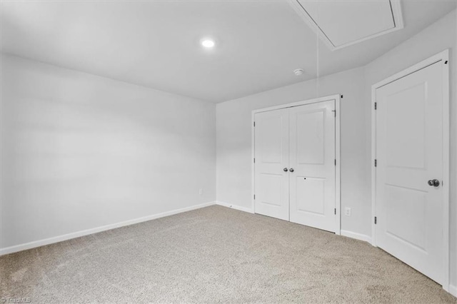 4192 Emmas Way E, Bend, NC 27018 - unfurnished bedroom with carpet, baseboards, a closet, recessed lighting, and attic access