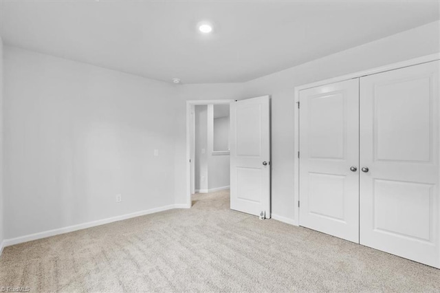 4192 Emmas Way E, Bend, NC 27018 - unfurnished bedroom featuring carpet flooring, baseboards, a closet, and recessed lighting
