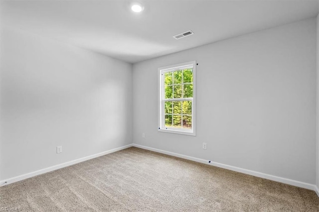 4192 Emmas Way E, Bend, NC 27018 - spare room featuring baseboards, carpet flooring, and recessed lighting