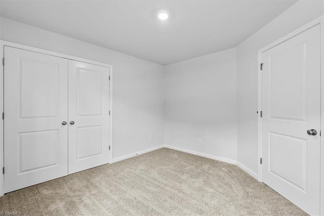 4192 Emmas Way E, Bend, NC 27018 - unfurnished bedroom featuring carpet floors, baseboards, a closet, and recessed lighting