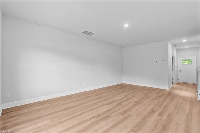 4192 Emmas Way E, Bend, NC 27018 - spare room featuring light wood-style floors, recessed lighting, and baseboards