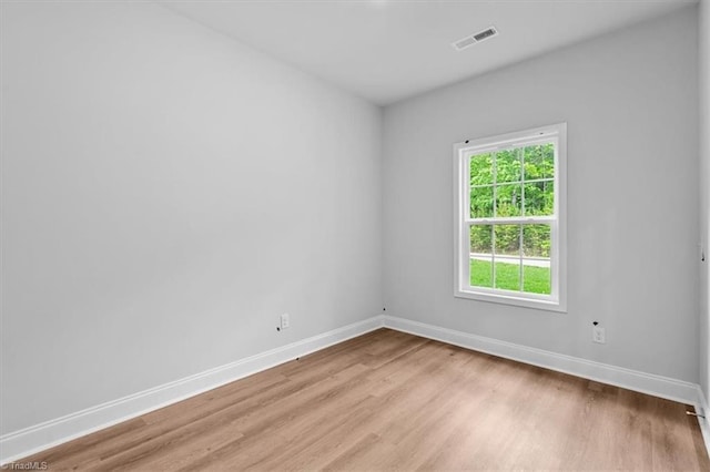 4192 Emmas Way E, Bend, NC 27018 - empty room featuring baseboards and light wood-style floors