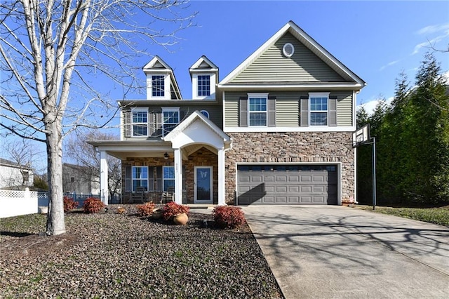 view of front of house featuring covered porch and a garage