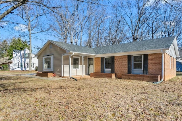 ranch-style house with a front lawn