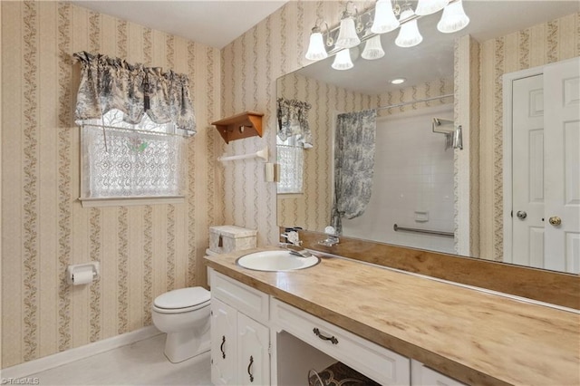 401 Joyce Rd, Hillsborough, NC 27278 - full bath with vanity, wallpapered walls, toilet, and walk in shower