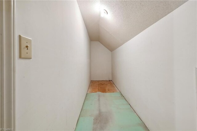 401 Joyce Rd, Hillsborough, NC 27278 - hallway with vaulted ceiling and a textured ceiling