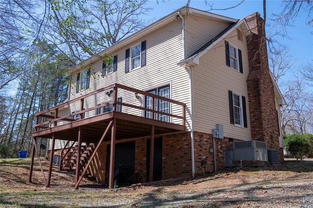 401 Joyce Rd, Hillsborough, NC 27278 - view of home's exterior featuring a wooden deck, brick siding, stairway, and a chimney