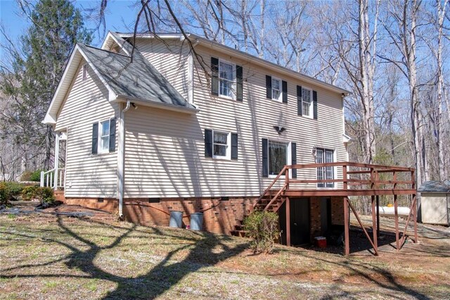 401 Joyce Rd, Hillsborough, NC 27278 - rear view of property with stairway and a wooden deck