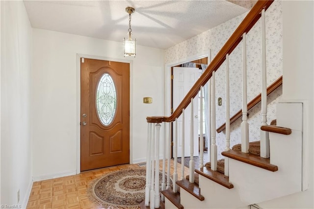 401 Joyce Rd, Hillsborough, NC 27278 - entryway with baseboards, a textured ceiling, wallpapered walls, and stairway