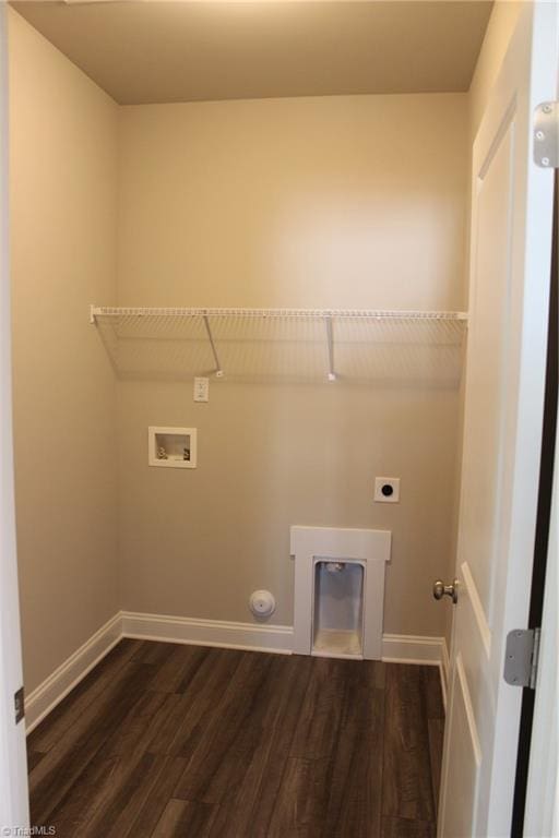 laundry area featuring laundry area, baseboards, dark wood-type flooring, hookup for a washing machine, and hookup for an electric dryer