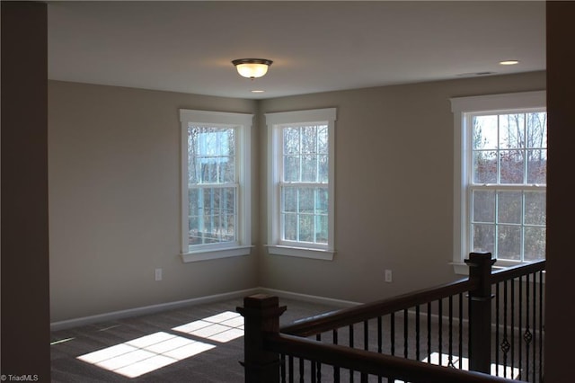 staircase featuring carpet, visible vents, and baseboards