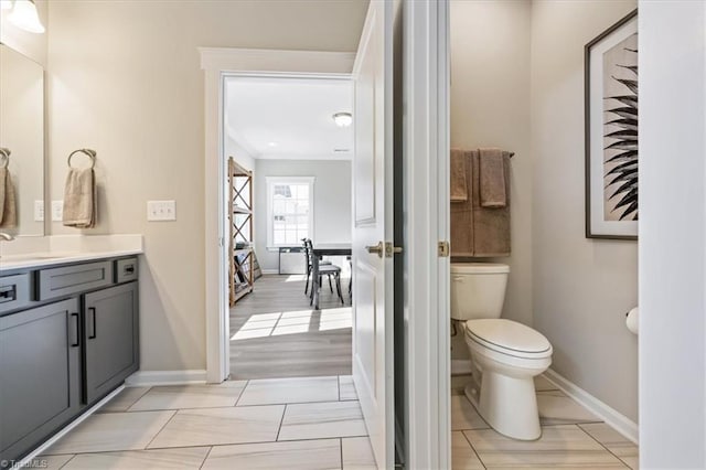 1085 Fairhaven Dr Lot # 49, Mebane, NC 27302 - bathroom featuring ornamental molding, baseboards, toilet, and vanity
