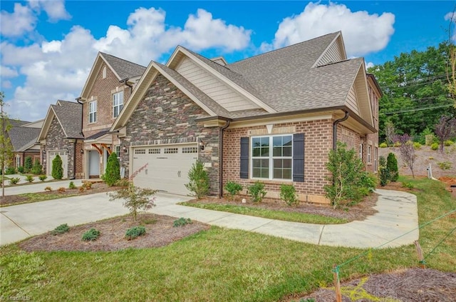 craftsman-style house featuring a front yard and a garage