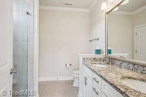 2834 Fallin Ct, High Point, NC 27262 - full bath with crown molding, double vanity, a tile shower, and tile patterned flooring