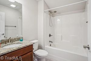 2834 Fallin Ct, High Point, NC 27262 - bathroom featuring vanity, shower / washtub combination, and tile patterned floors