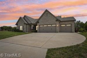 2834 Fallin Ct, High Point, NC 27262 - view of front of property with a garage, driveway, and a lawn