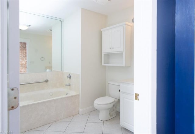 bathroom featuring toilet, tile patterned flooring, a bath, and vanity