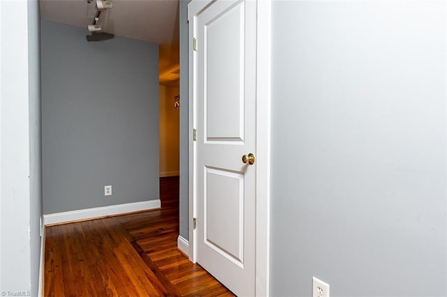 corridor with dark wood-type flooring