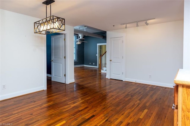 unfurnished dining area featuring dark hardwood / wood-style flooring and ceiling fan