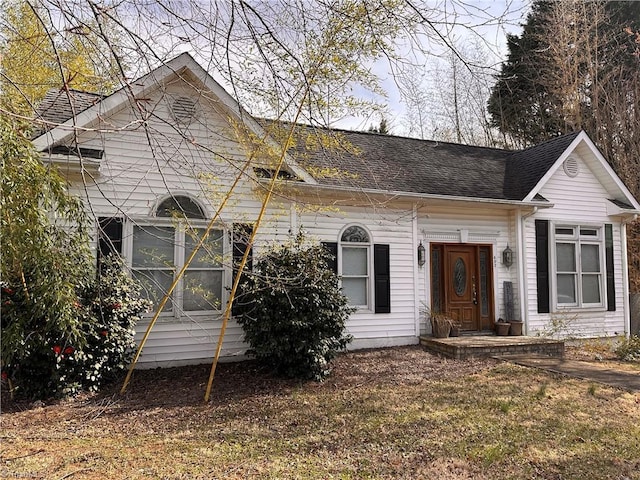 view of front of house featuring roof with shingles